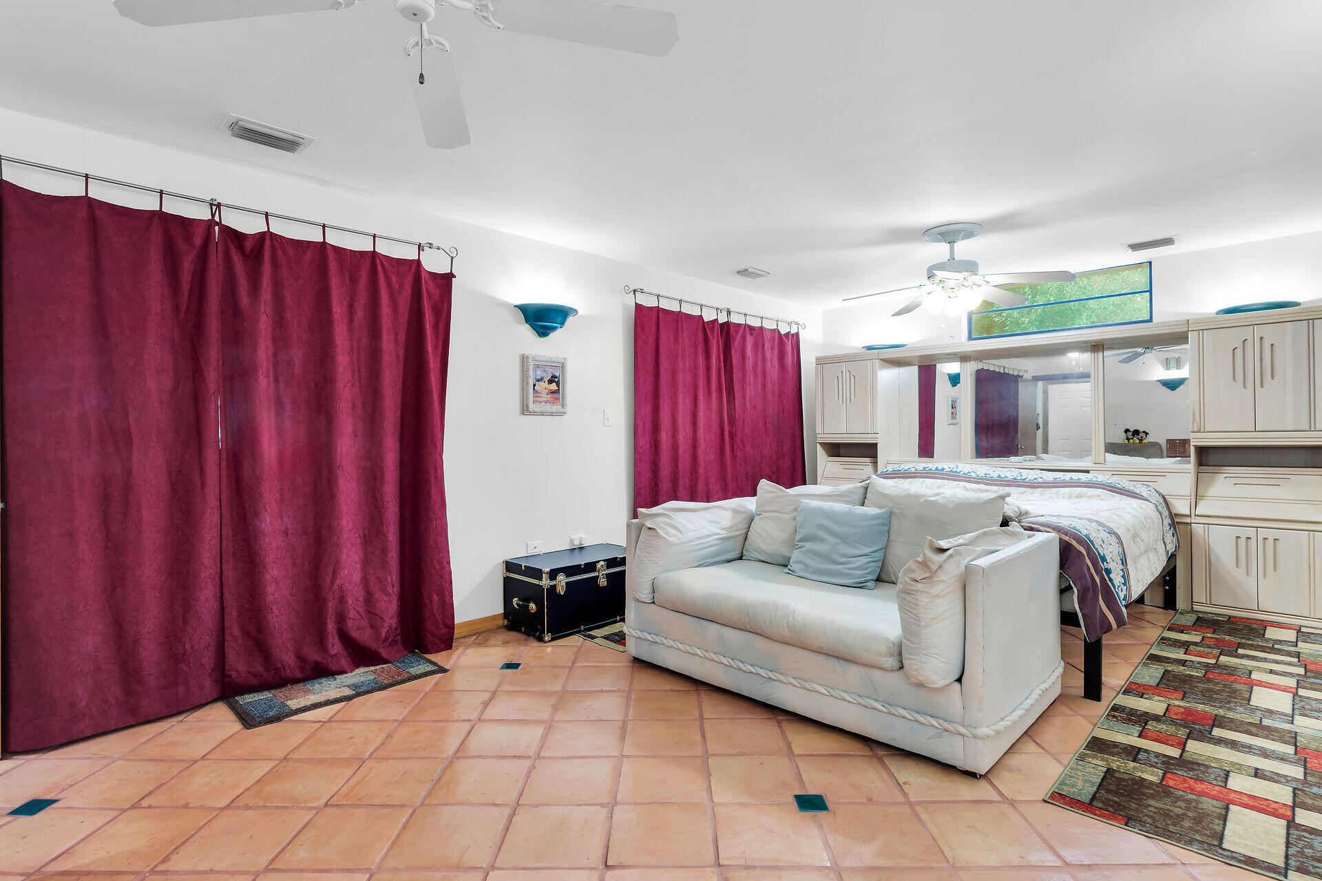 323 Bayview Avenue Key Largo, FL 33037 - Photo 10 of 46 a living room with furniture and a chandelier