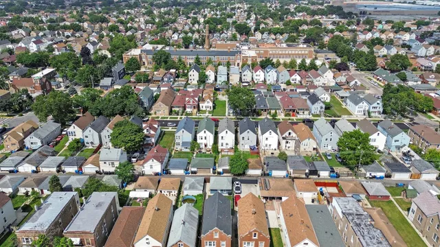 an aerial view of residential houses with outdoor space