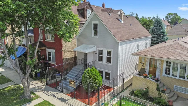 a aerial view of a house with garden