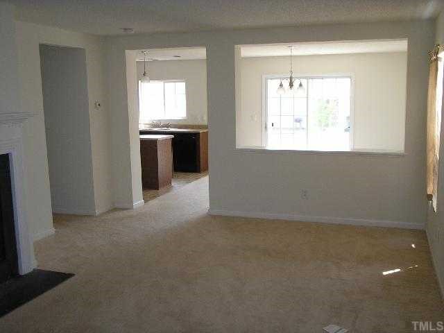 6004 Namozine Court Raleigh, NC 27610 - Photo 3 of 12 a view of an empty room with a window