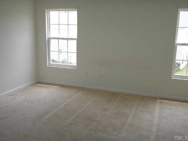 6004 Namozine Court Raleigh, NC 27610 - Photo 8 of 12 an empty room with a window
