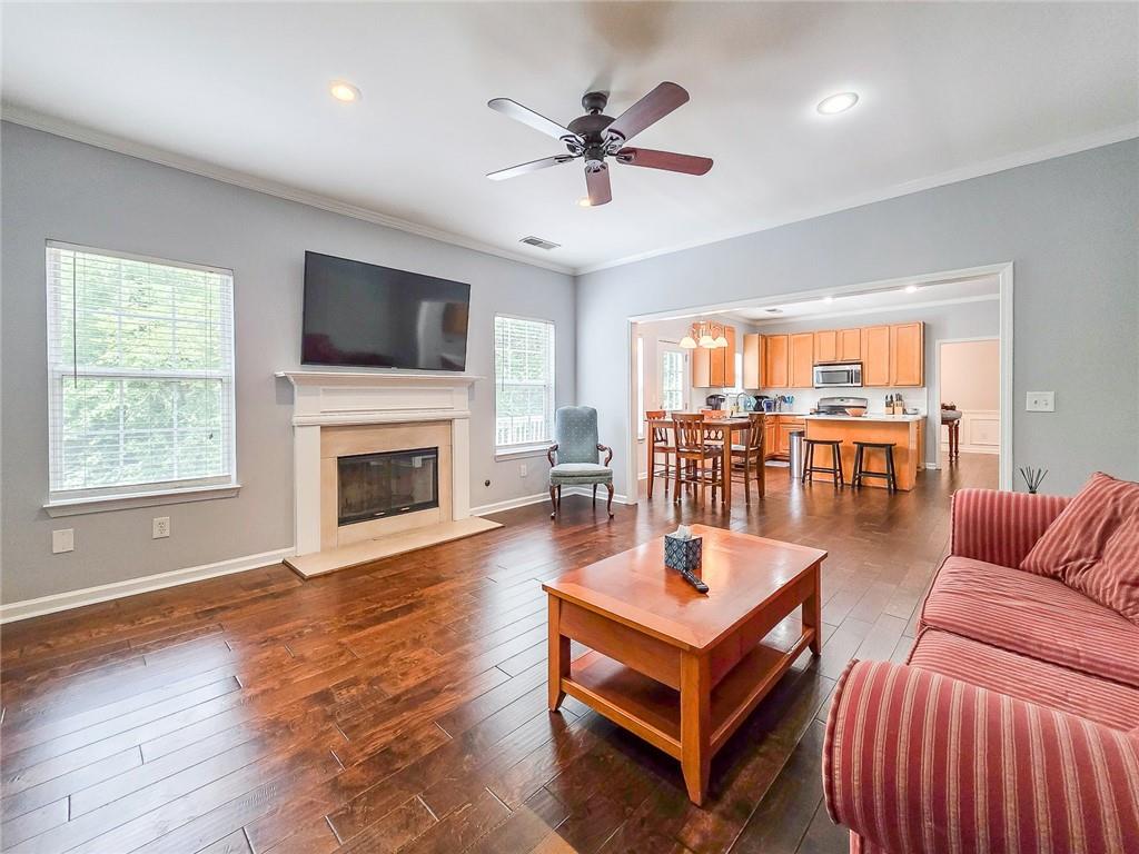 43 Ivy Mist Lane Acworth, GA 30101 - Photo 11 of 58 a living room with furniture a flat screen tv and a fireplace