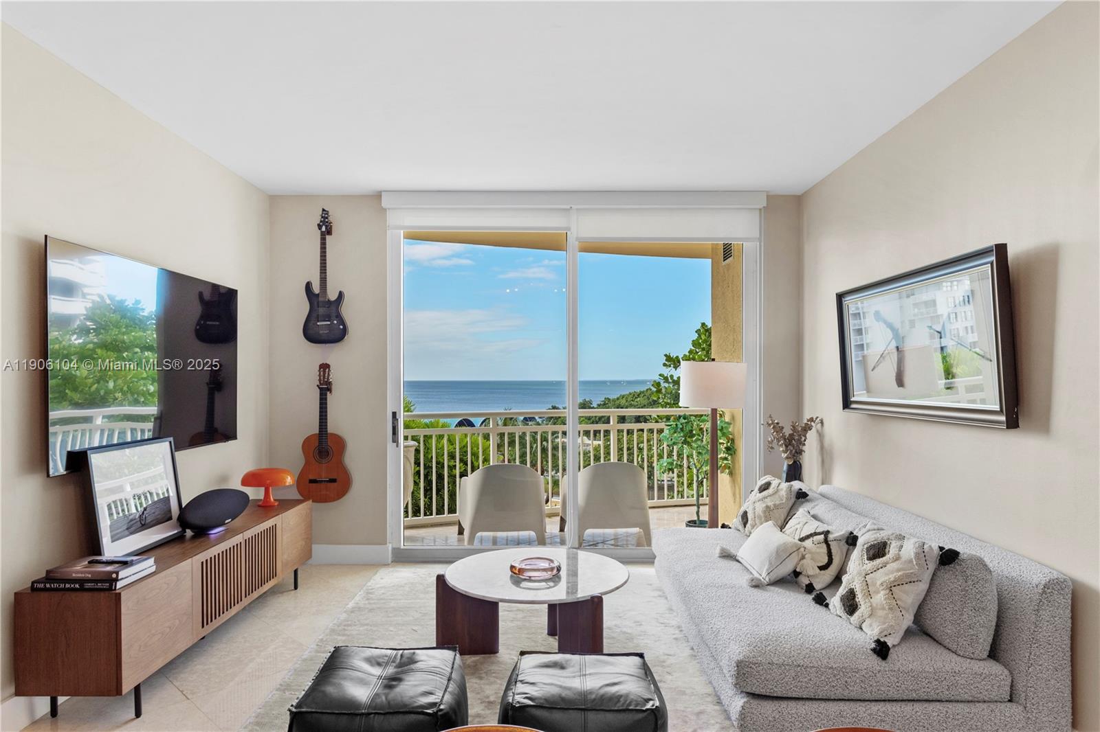 2475 Brickell Avenue, Unit 708 Miami, FL 33129 - Photo 1 of 21 a living room with furniture and a large window