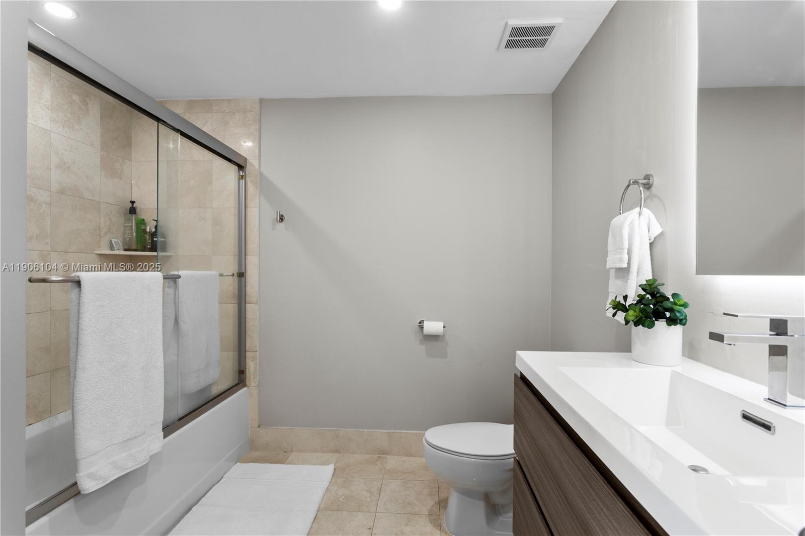 2475 Brickell Avenue, Unit 708 Miami, FL 33129 - Photo 13 of 21 a bathroom with a sink a toilet and shower