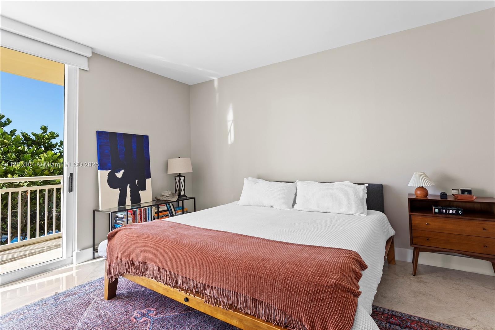 2475 Brickell Avenue, Unit 708 Miami, FL 33129 - Photo 17 of 21 a bed sitting in a bedroom next to a window