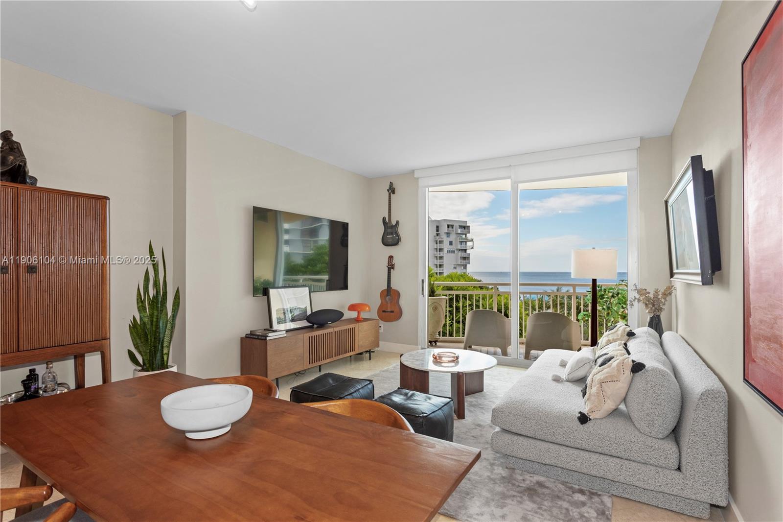 2475 Brickell Avenue, Unit 708 Miami, FL 33129 - Photo 4 of 21 a living room with furniture and a large window