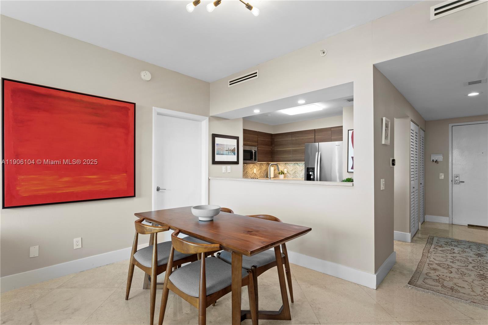 2475 Brickell Avenue, Unit 708 Miami, FL 33129 - Photo 9 of 21 a view of a dining room with furniture