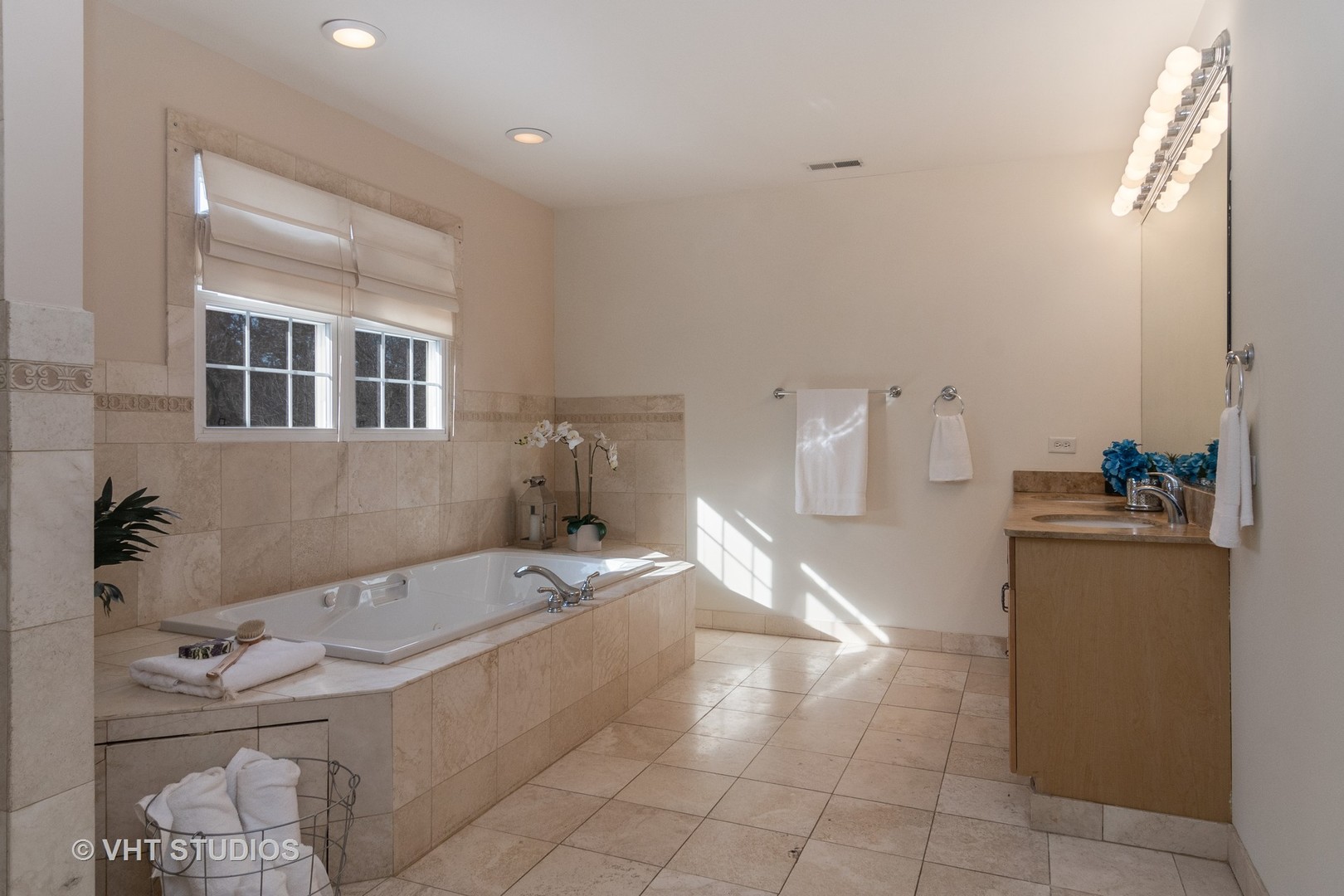 2422 Central Road Glenview, IL 60025 - Photo 11 of 18 a spacious bathroom with a tub sink and mirror