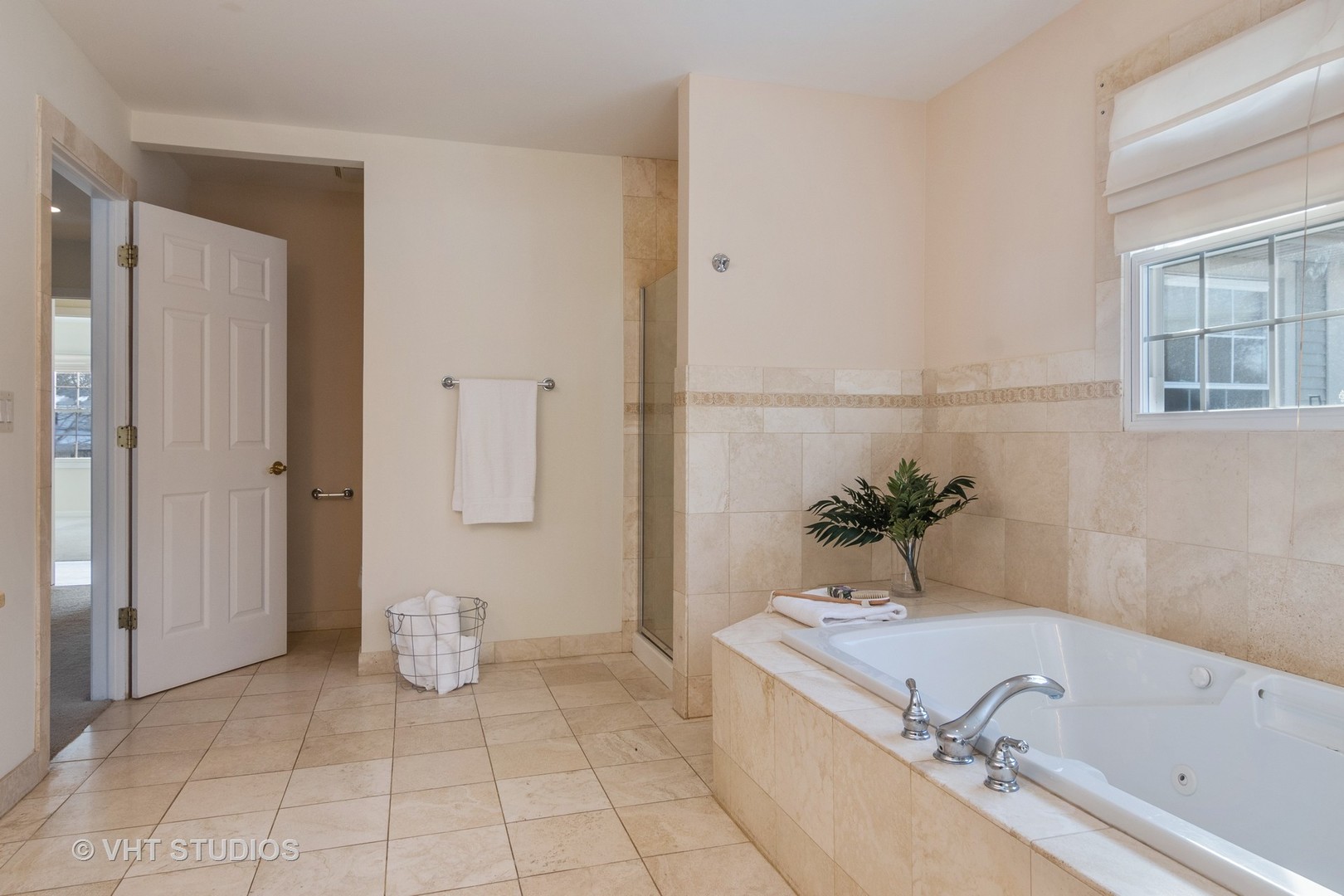 2422 Central Road Glenview, IL 60025 - Photo 12 of 18 a bathroom with a tub sink and mirror