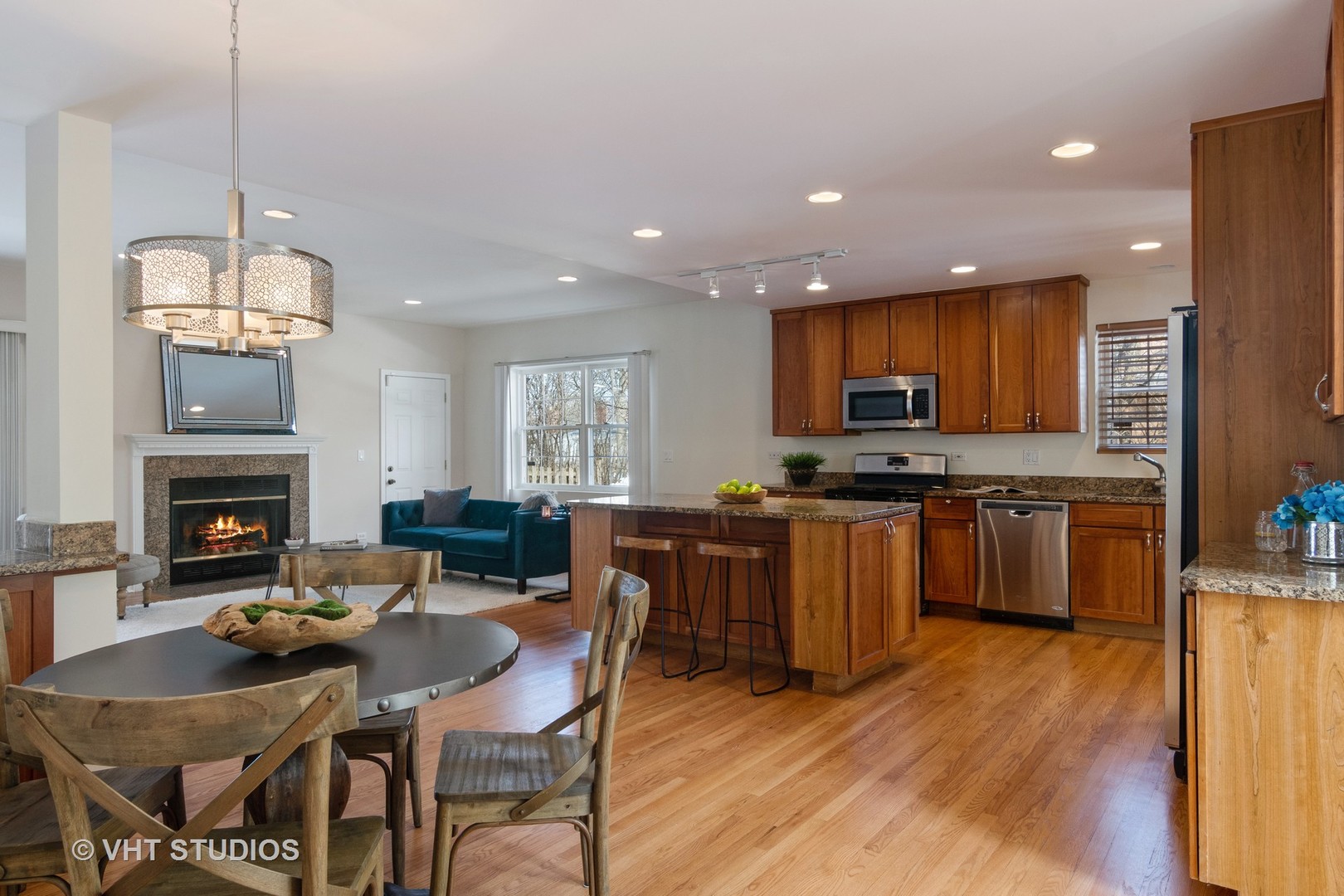 2422 Central Road Glenview, IL 60025 - Photo 4 of 18 a open kitchen with granite countertop wooden floor a center island stainless steel appliances and cabinets