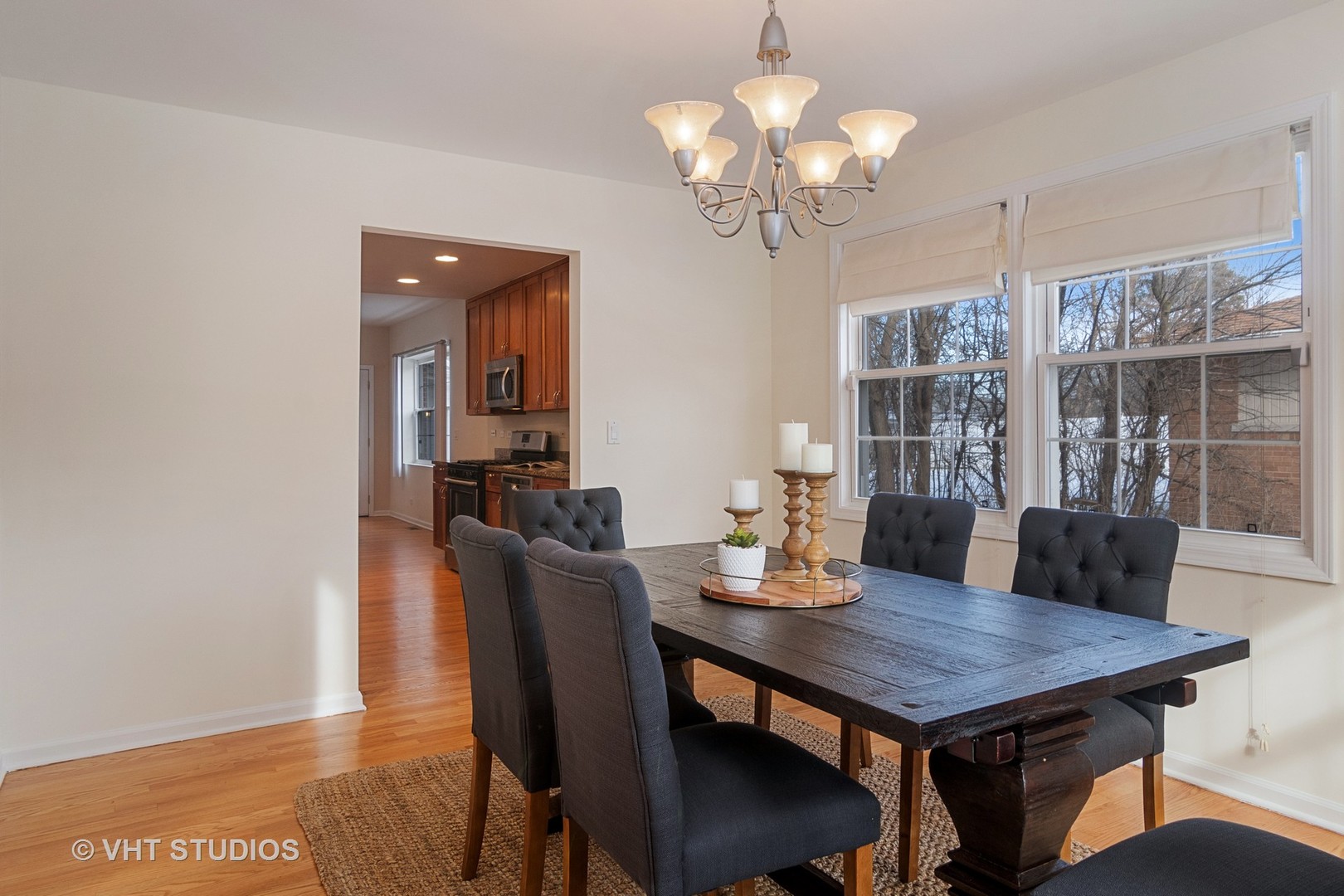 2422 Central Road Glenview, IL 60025 - Photo 5 of 18 a view of a dining room with furniture wooden floor and chandelier