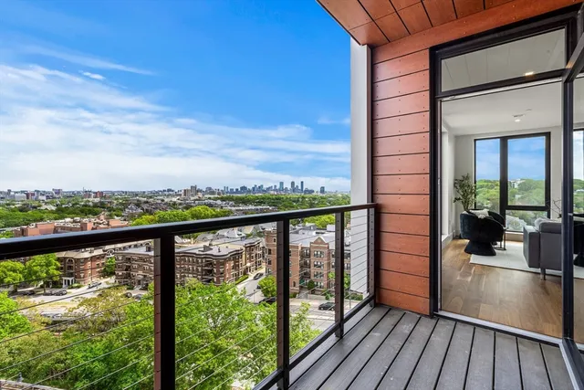a view of a balcony with wooden floor