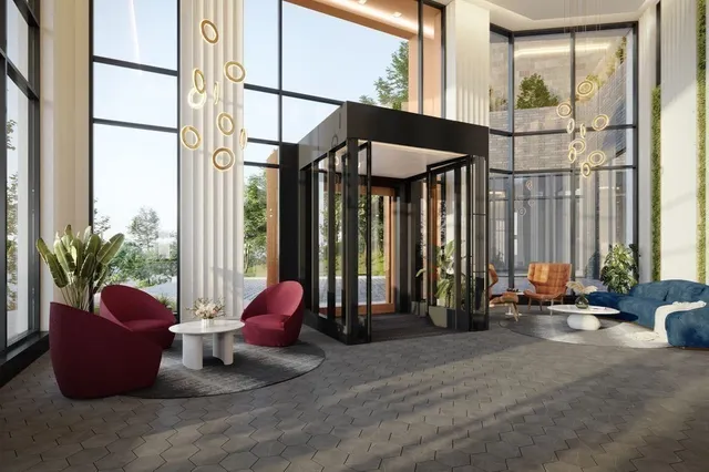 a lobby with furniture and floor to ceiling window