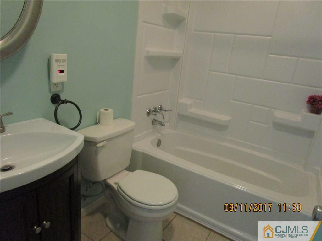 33 Winthrop Road Edison, NJ 08817 - Photo 14 of 23 a bathroom with a sink a toilet and shower