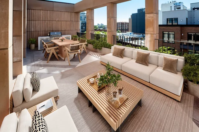 a outdoor living area with furniture and a rug