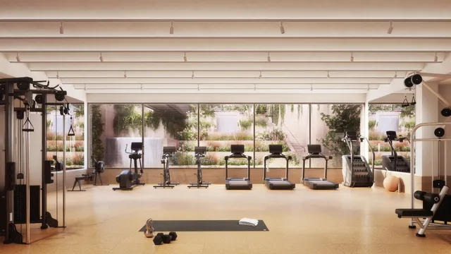 a dining room with large glass table and chairs