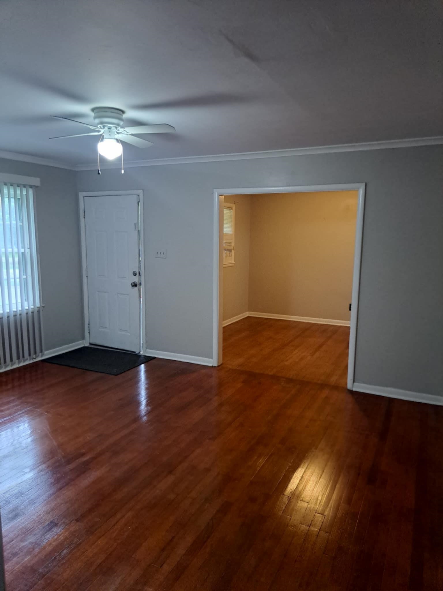 1351 Janis Drive Memphis, TN 38116 - Photo 16 of 27 Unfurnished room with ornamental molding, dark wood-style flooring, and ceiling fan