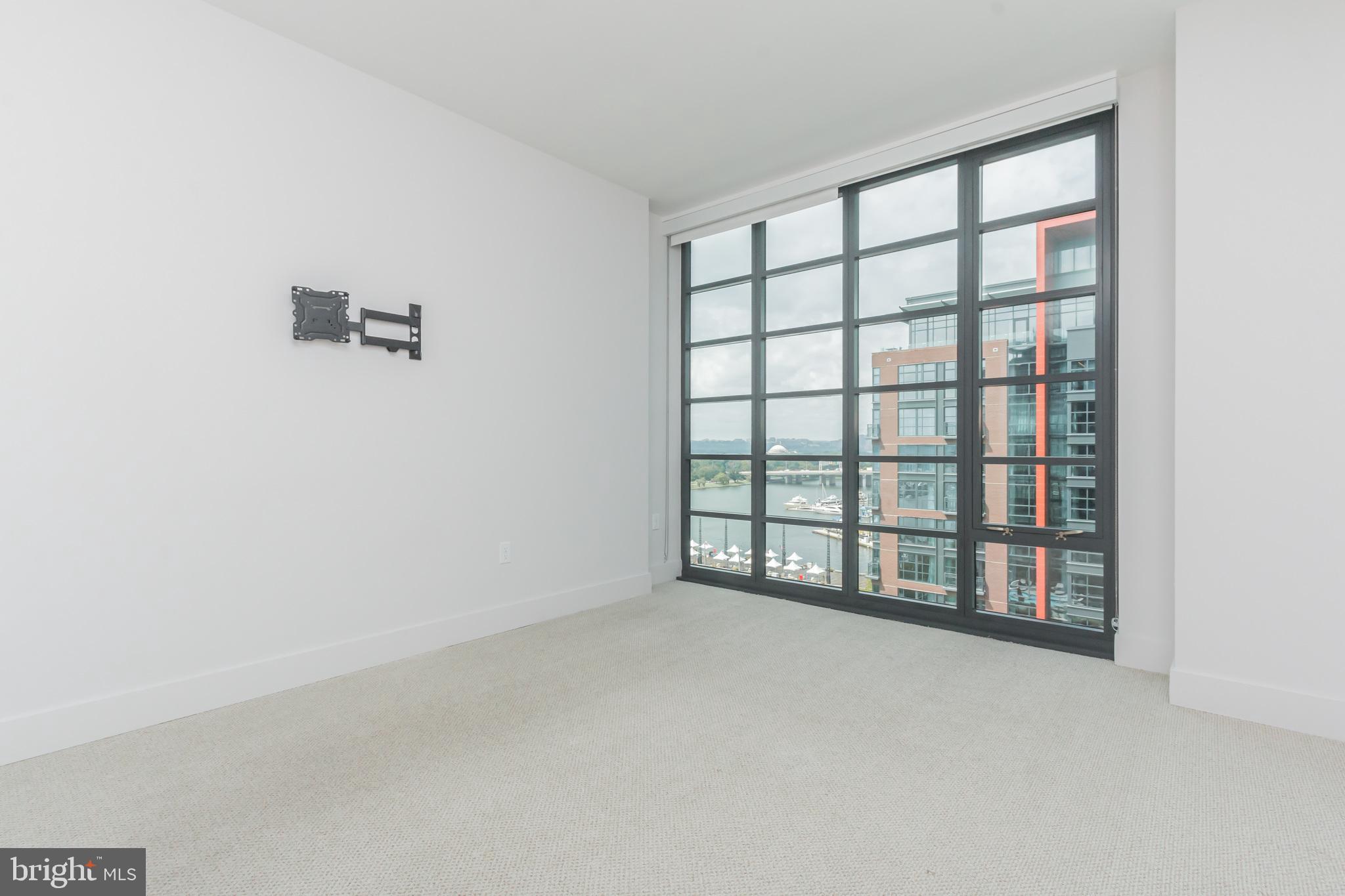 45 Sutton Square Southwest, Unit 906 Washington, DC 20024 - Photo 12 of 31 Primary bedroom with water views
