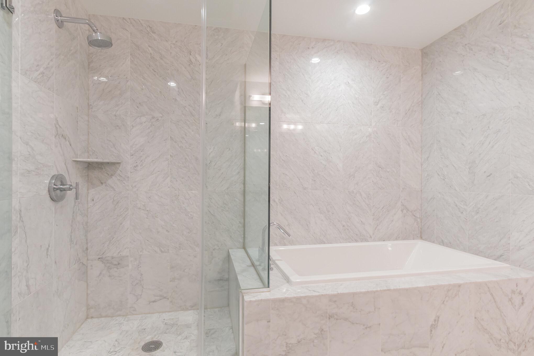 45 Sutton Square Southwest, Unit 906 Washington, DC 20024 - Photo 16 of 31 Soaking tub and separate shower in primary bath