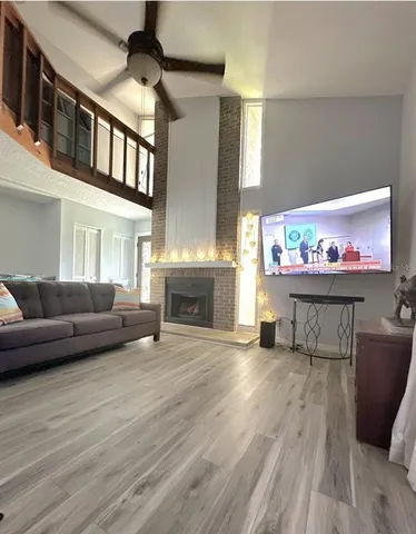 a dining room with furniture and wooden floor
