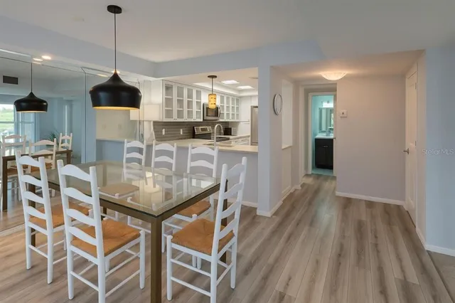 a view of a balcony with lake view and a potted plant