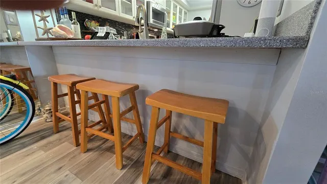 a spacious bathroom with a sink and a mirror