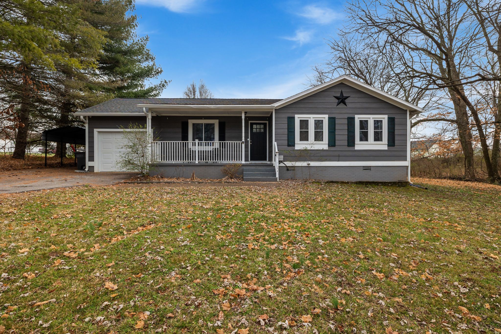 a front view of a house with yard