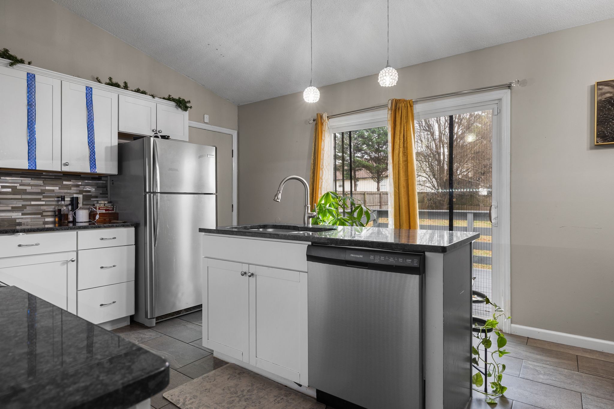 1516 Richmond Road Columbia, TN 38401 - Photo 13 of 26 a kitchen with a refrigerator and a sink