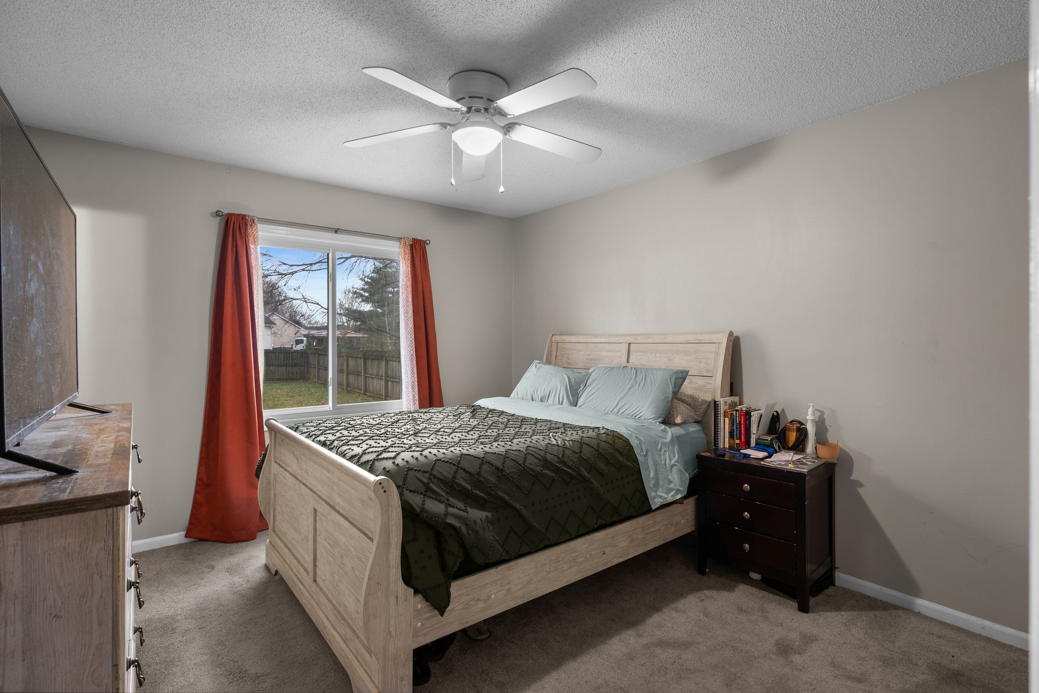 1516 Richmond Road Columbia, TN 38401 - Photo 16 of 26 a bed sitting in a bedroom next to a window