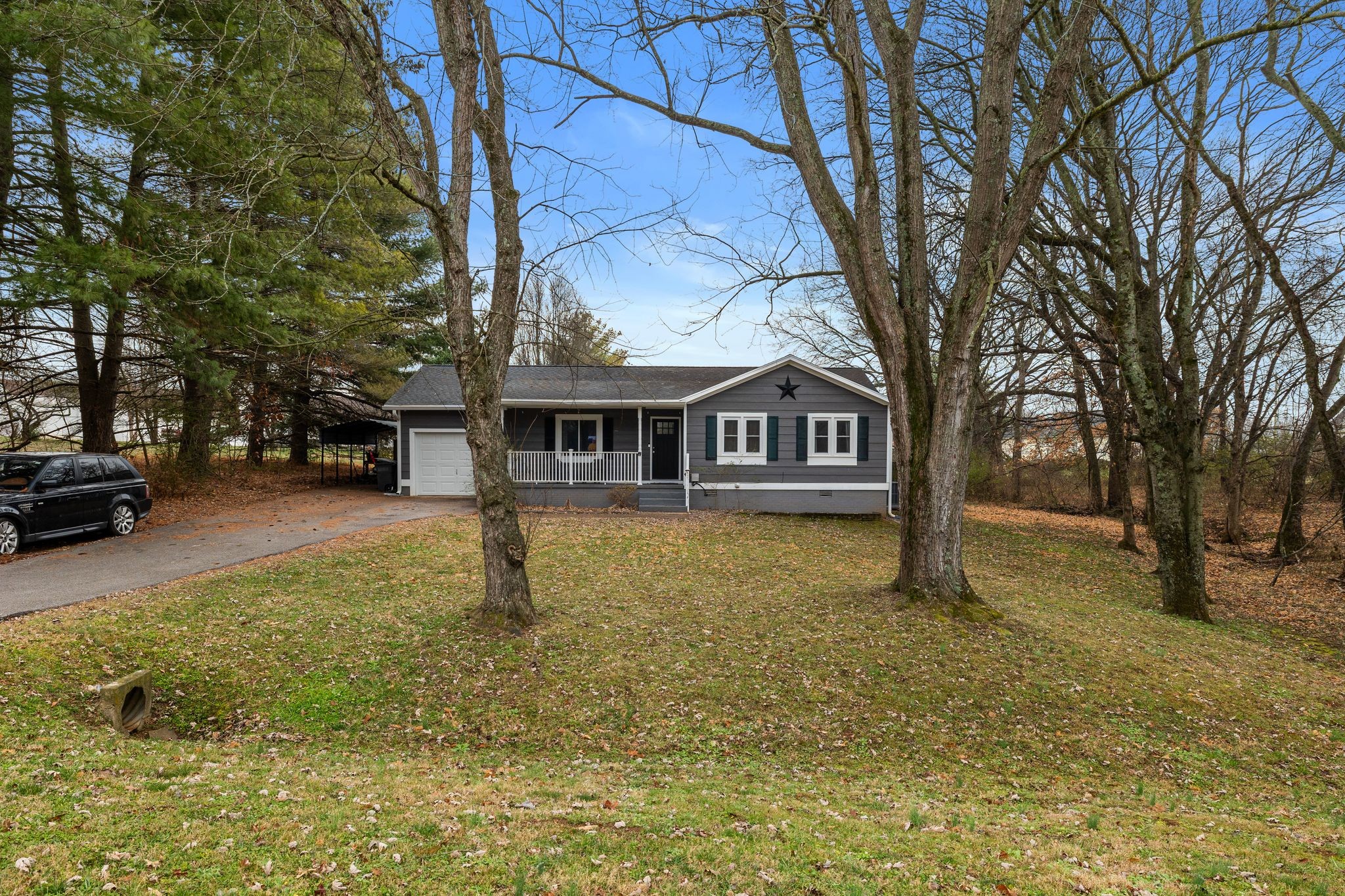 1516 Richmond Road Columbia, TN 38401 - Photo 3 of 26 a house with trees in front of it