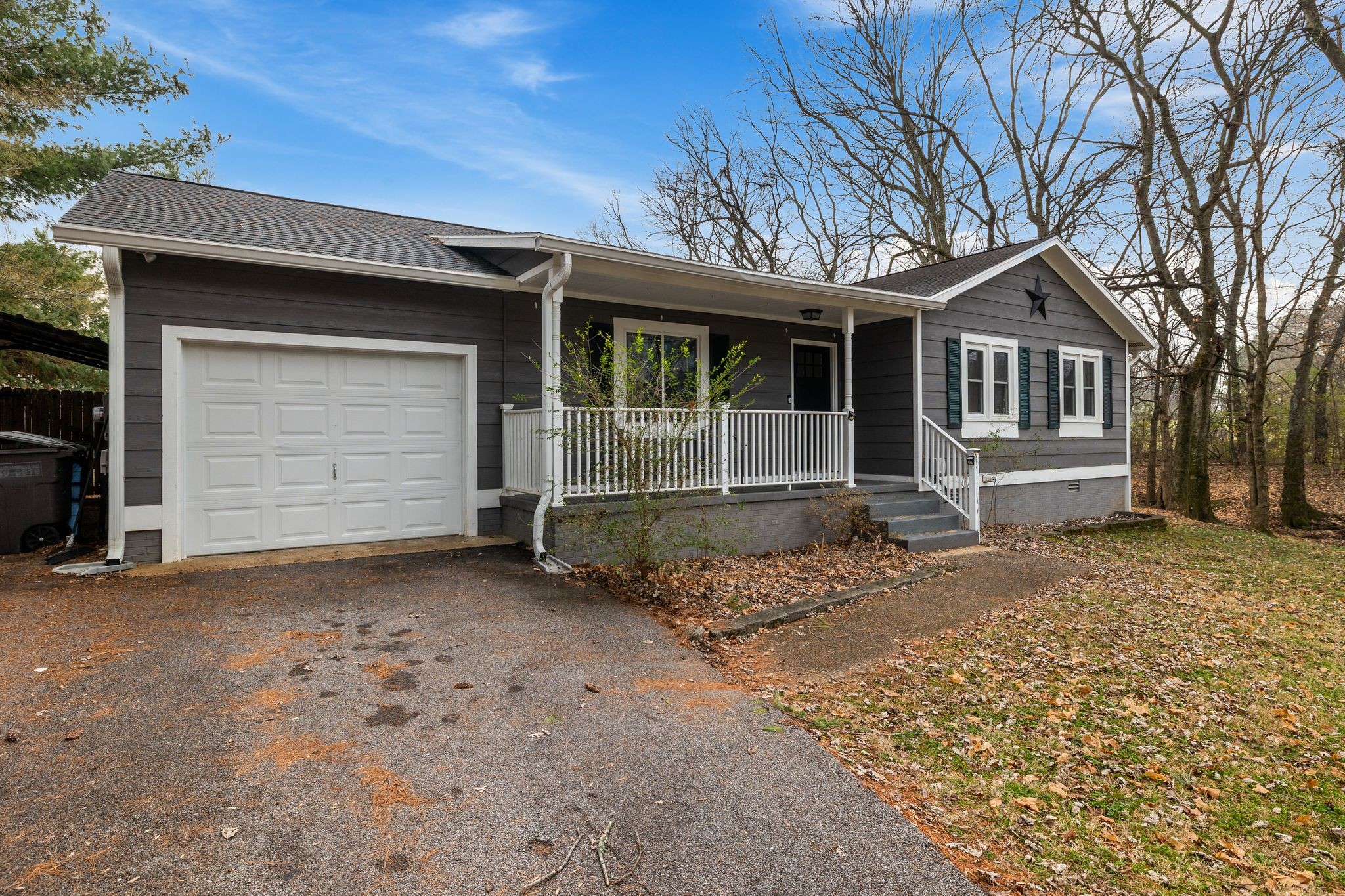 1516 Richmond Road Columbia, TN 38401 - Photo 4 of 26 a front view of a house with a yard and garage