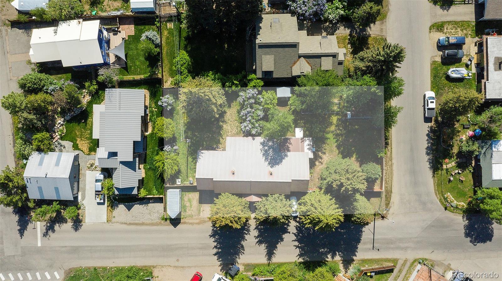 512 Laurel Street Steamboat Springs, CO 80487 - Photo 1 of 8 an aerial view of a house with a yard and garden