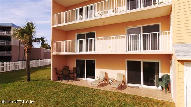 4 Ocean Trace Road, Unit 108 St. Augustine, FL 32080 - Photo 1 of 21 a backyard of a house with seating space