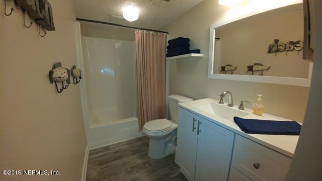 4 Ocean Trace Road, Unit 108 St. Augustine, FL 32080 - Photo 13 of 21 a bathroom with a sink toilet and shower