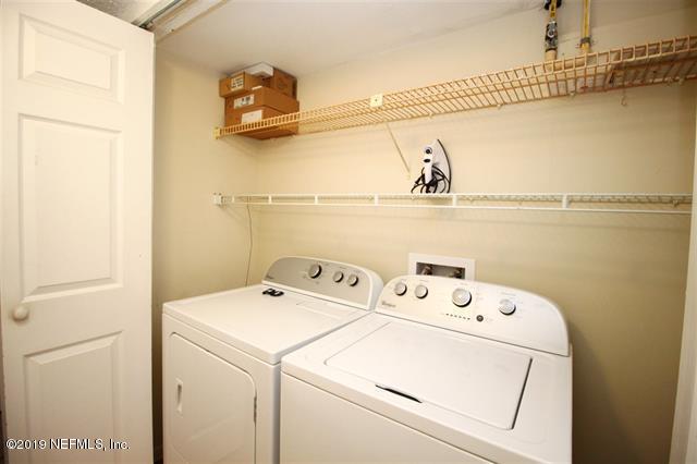 4 Ocean Trace Road, Unit 108 St. Augustine, FL 32080 - Photo 16 of 21 a utility room with dryer and washer