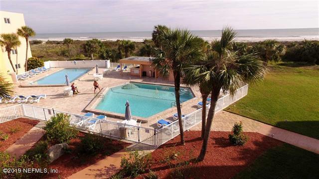 4 Ocean Trace Road, Unit 108 St. Augustine, FL 32080 - Photo 19 of 21 a view of a swimming pool with lounge chair