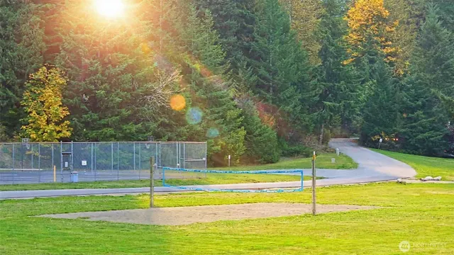a view of a swimming pool with an outdoor space and seating area
