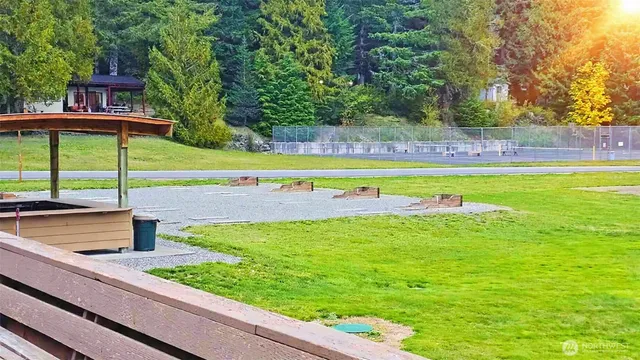 a view of a backyard with a swimming pool