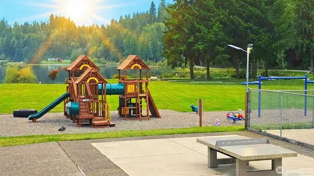 an outdoor space with furniture and garden