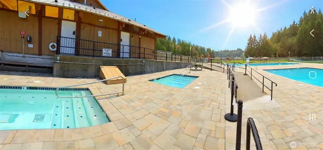 a view of a swimming pool with a lounge chairs