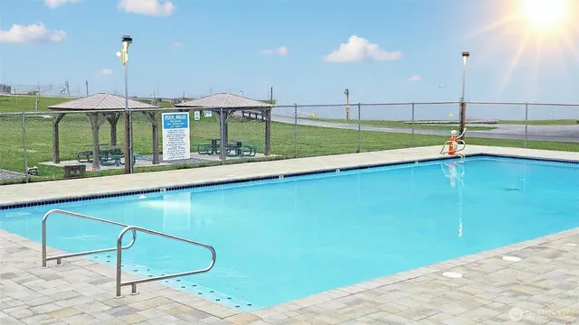 a view of a living room with a swimming pool
