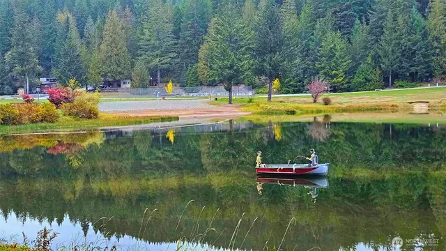 a view of a swimming pool and a yard
