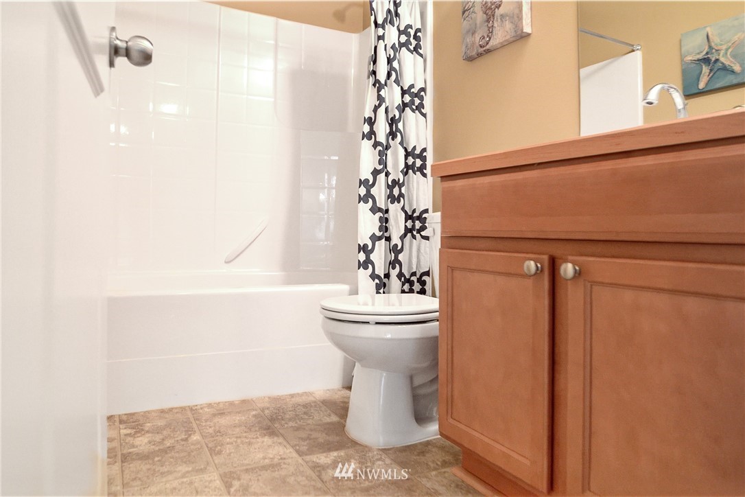 3801 219th Place Southeast Bothell, WA 98021 - Photo 17 of 22 a bathroom with a toilet and a shower