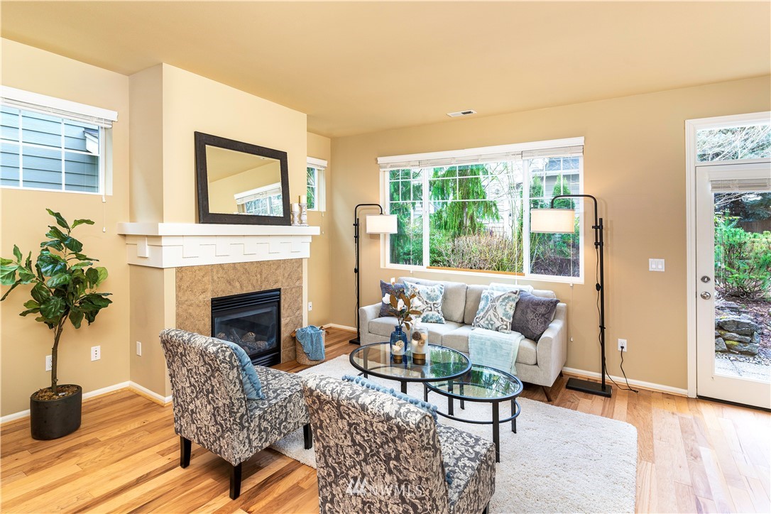 3801 219th Place Southeast Bothell, WA 98021 - Photo 5 of 22 a living room with furniture and a fireplace