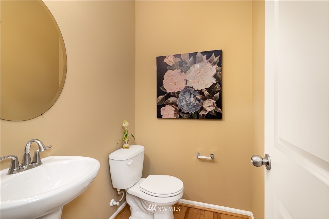 3801 219th Place Southeast Bothell, WA 98021 - Photo 8 of 22 a bathroom with a toilet a sink and mirror