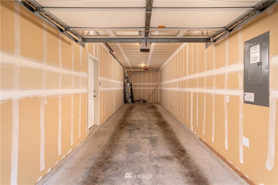 3801 219th Place Southeast Bothell, WA 98021 - Photo 9 of 22 a view of a garage with wooden floor and white walls