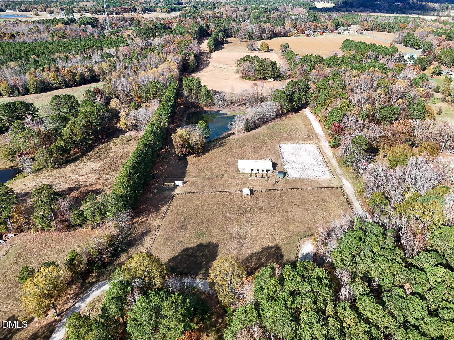 9637 Earpsboro Chamblee Road Zebulon, NC 27597 - Photo 40 of 42 an aerial view of a house with a yard and lake view in back