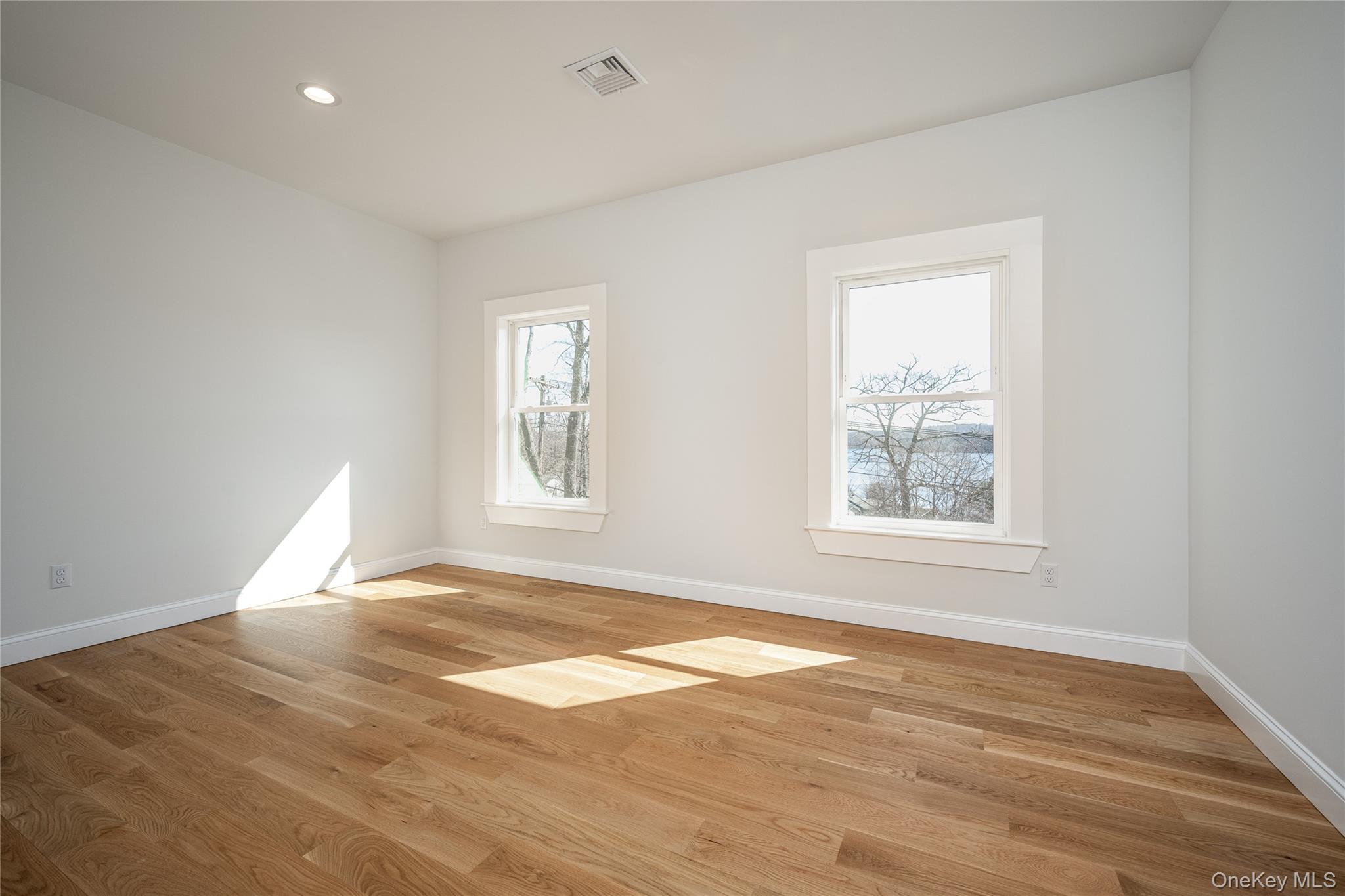 133 West Mombasha Road Monroe, NY 10950 - Photo 36 of 47 a view of empty room with wooden floor and fan