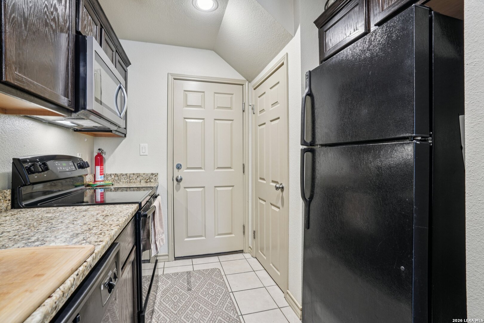 2312 Sailing Way, Unit A Kerrville, TX 78028 - Photo 13 of 29 a kitchen with stainless steel appliances granite countertop a refrigerator and a stove