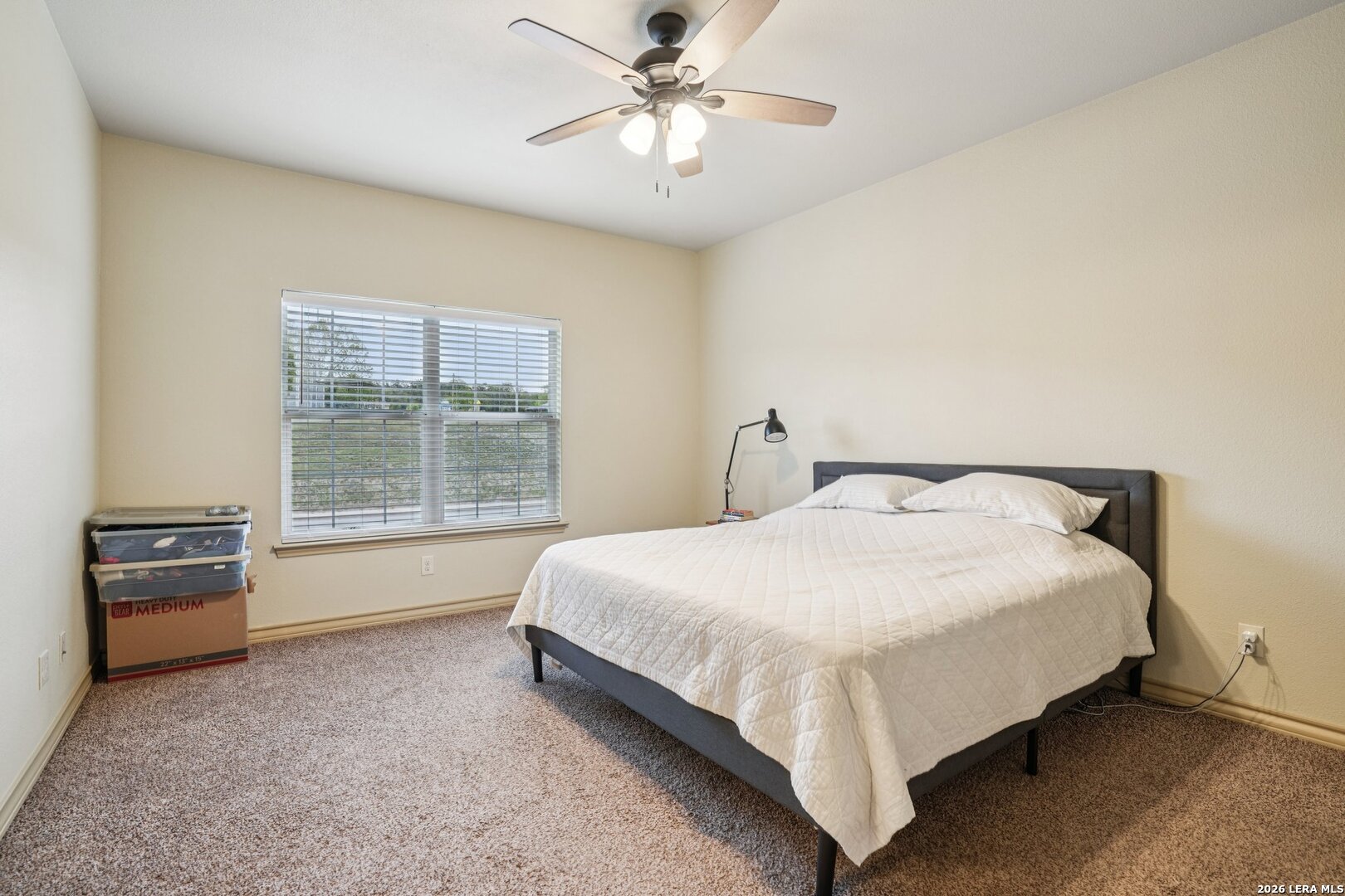 2312 Sailing Way, Unit A Kerrville, TX 78028 - Photo 16 of 29 a large bed sitting in a room next to a window